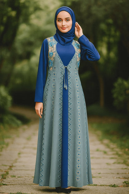Woman wearing a blue and gray dress with a hijab in a park setting