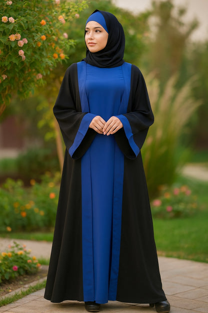 Woman wearing a black and blue abaya in a garden setting