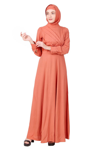 A woman wearing a redwood rayon abaya with a mandarin collar and straight sleeves, paired with a matching square hijab.