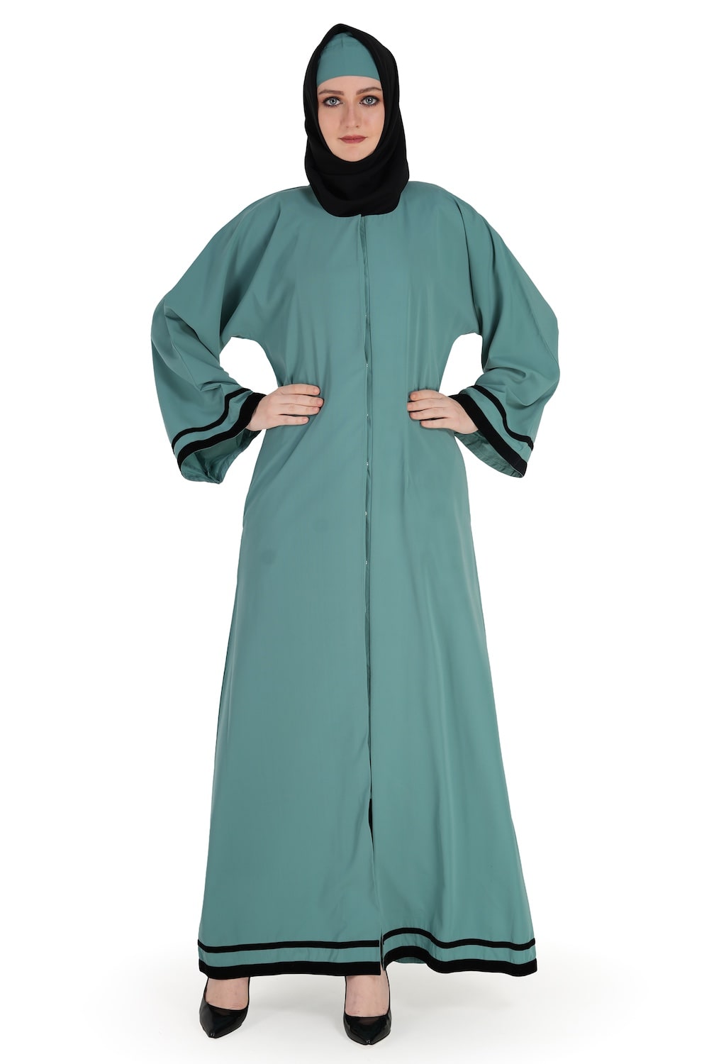 A sea green abaya with black velvet lace and a high collar neckline. The abaya is shown on a model who is facing forward, wearing the garment open with snap button closure and straight sleeves with embellishments.