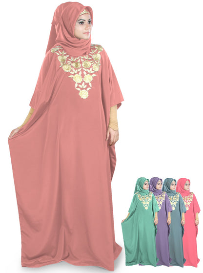A model wearing a pink Naeema Kaftan with floral embroidery at the neckline, also showing matching colors for hijab and belt.