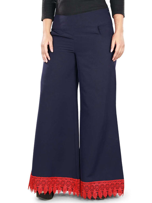 Navy blue palazzo pants with red lace detailing at the bottom and a side zipper closure.