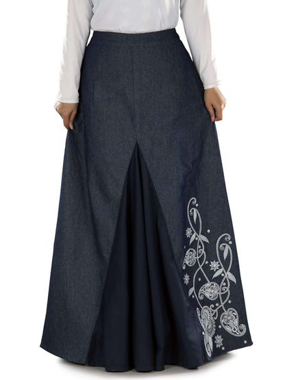 A navy blue denim skirt with embroidered floral design on the front and elastic waist at the back.