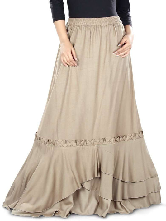 A khaki-colored, flared rayon skirt with asymmetrical multi-layered panels at the bottom and a lace embellishment above the panels.