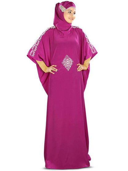 A model wearing a magenta hand embroidered Kaftan with silver zari and sequin embroidery at the waist and sleeves, paired with a matching square or rectangular hijab.